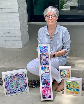 Anne Burtt with colorful art work
